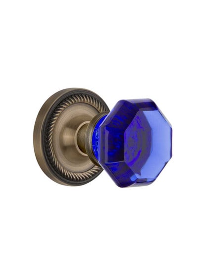 Rope Rosette Door Set with Colored Waldorf Crystal Glass Knobs Cobalt Blue in Antique Brass.